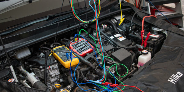 Diagnostic tests being performed with the use of 2 multimeters, a resistance box and oscilloscope.